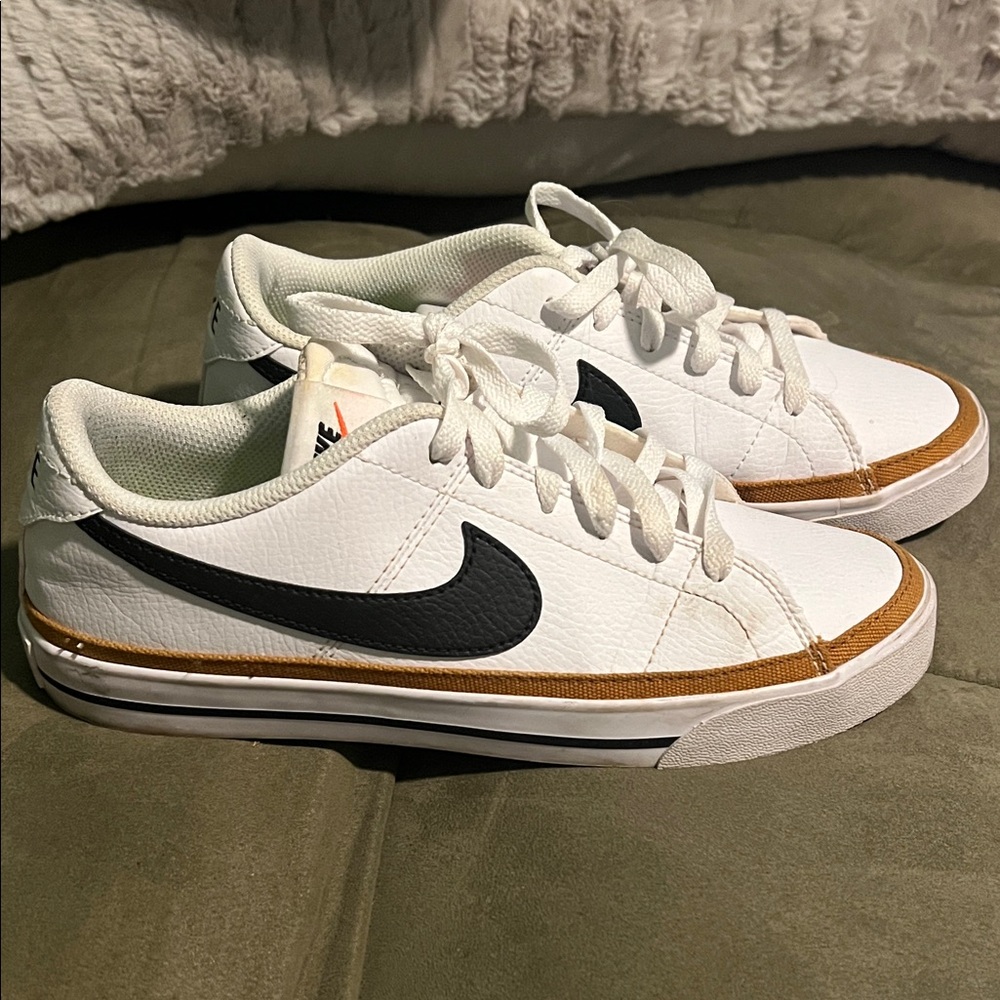 Nike White Low-Top Sneakers with Black Swoosh and Brown Trim